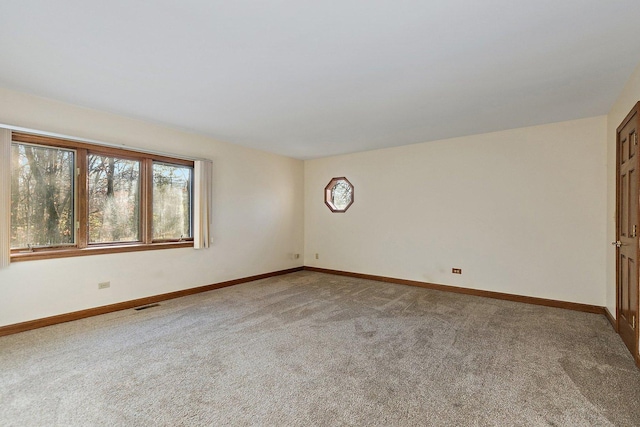 empty room featuring carpet flooring