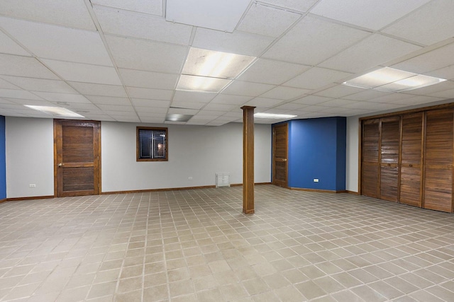 basement featuring a paneled ceiling