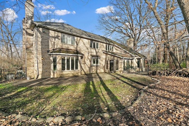 rear view of property featuring a patio