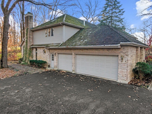 view of property exterior with a garage