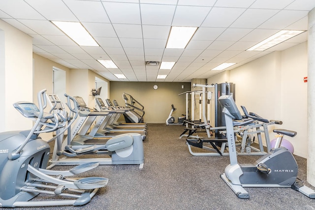 workout area featuring a paneled ceiling