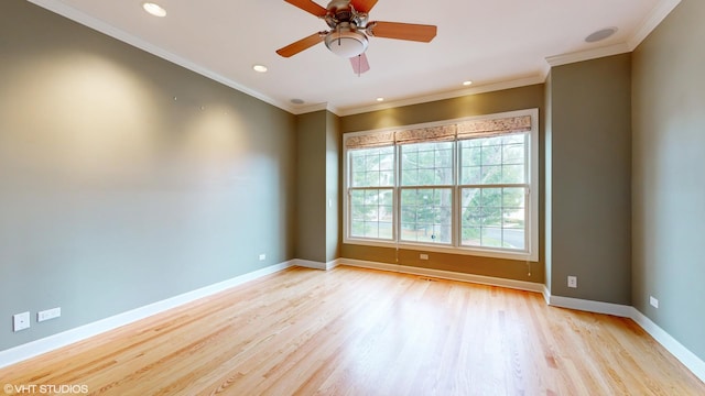 empty room with light hardwood / wood-style flooring, ceiling fan, and crown molding