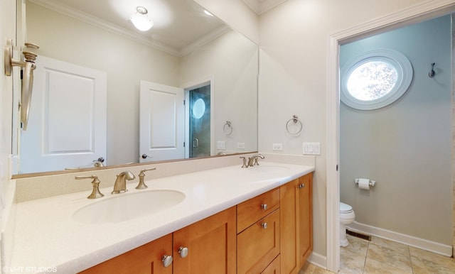 bathroom with tile patterned flooring, vanity, toilet, and crown molding