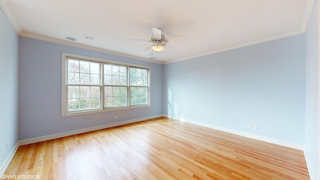 empty room featuring ceiling fan, light hardwood / wood-style flooring, and ornamental molding