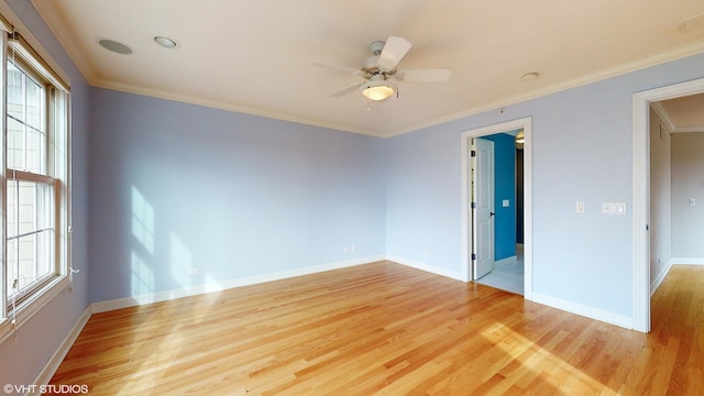 unfurnished room with light hardwood / wood-style floors, ceiling fan, and crown molding