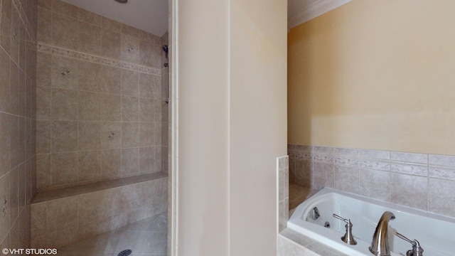 bathroom featuring a relaxing tiled tub