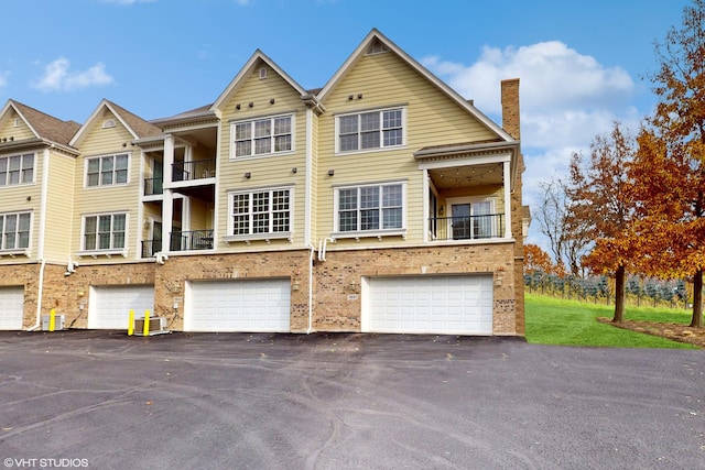 multi unit property featuring a garage