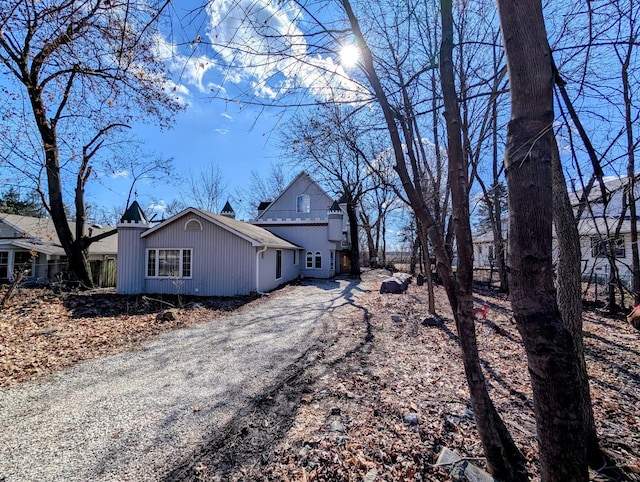 view of side of home featuring driveway