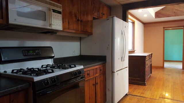 bathroom featuring hardwood / wood-style floors, toilet, and sink