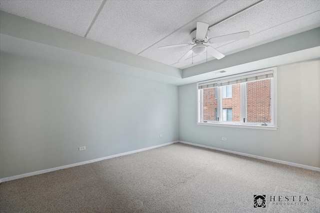 unfurnished room featuring carpet and ceiling fan