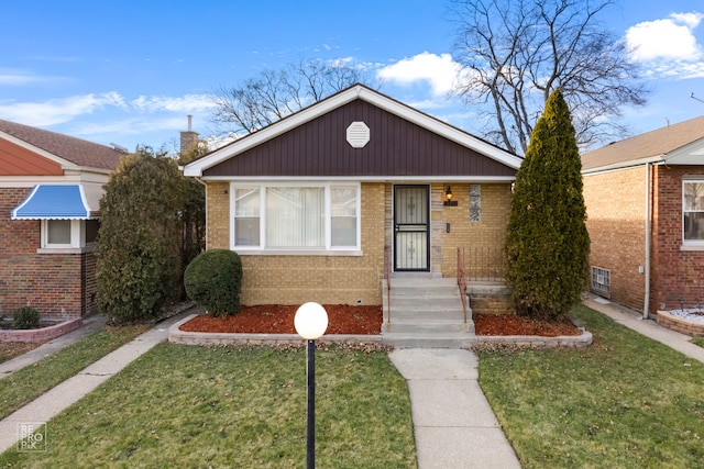 bungalow-style home with a front lawn