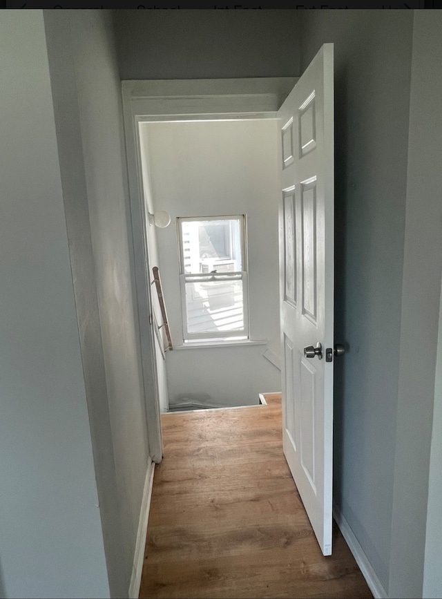 hallway with light wood-type flooring