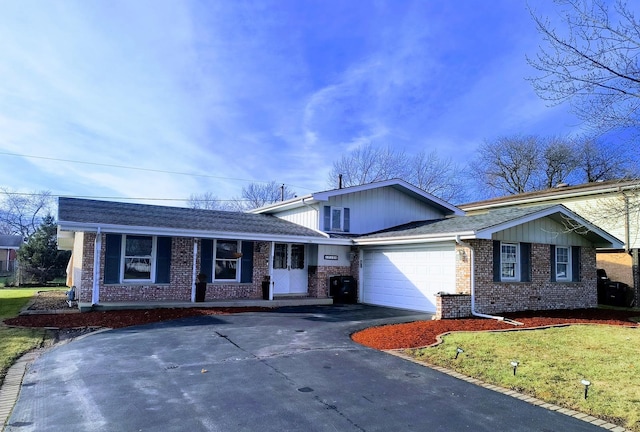 ranch-style house with a garage and a front lawn