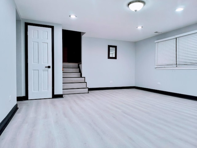 spare room with light hardwood / wood-style flooring