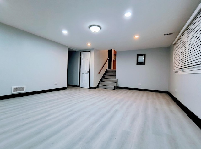 basement featuring light hardwood / wood-style floors