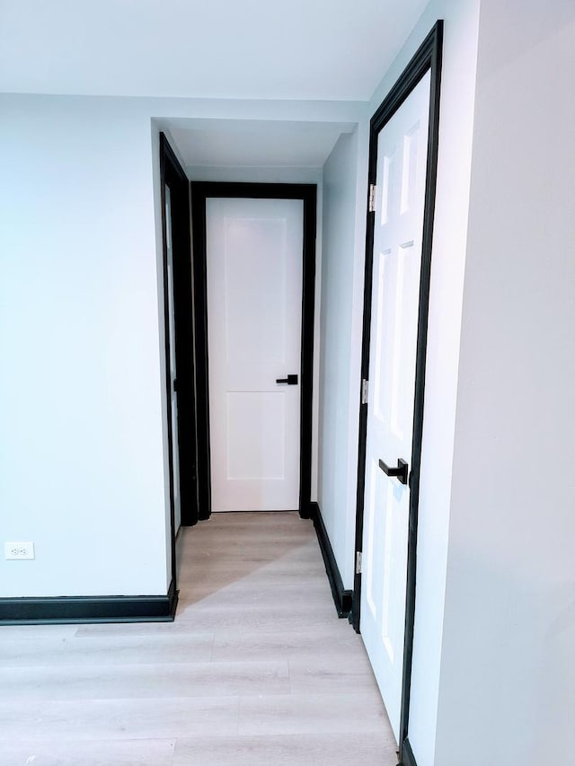 corridor featuring light hardwood / wood-style flooring