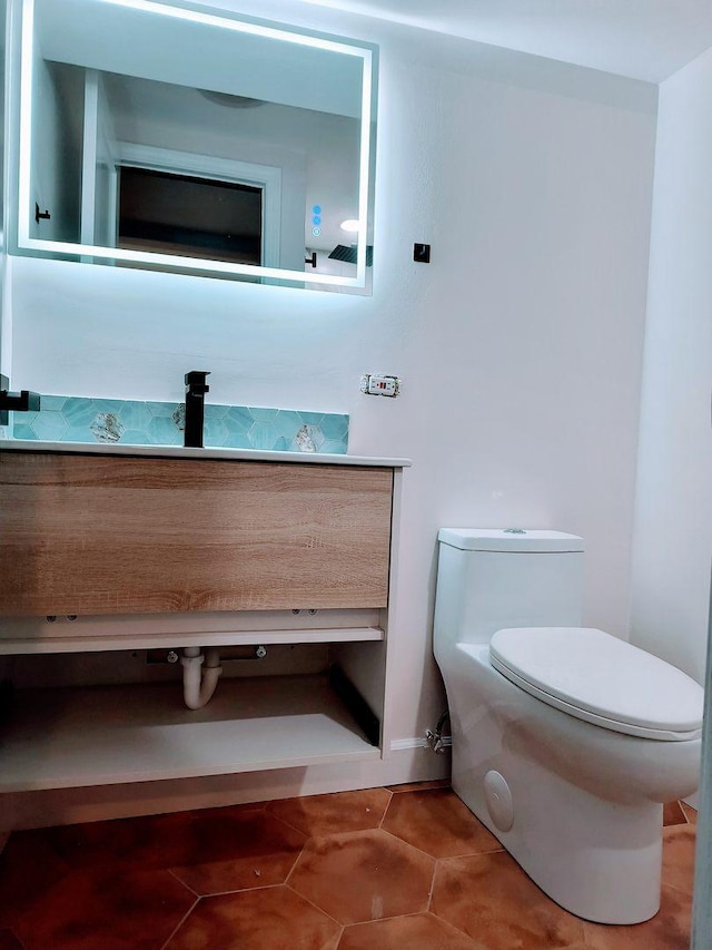 bathroom with vanity and toilet