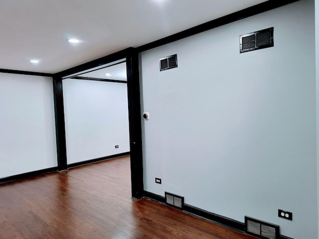 empty room with hardwood / wood-style flooring