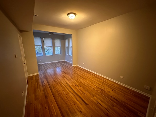 unfurnished room featuring ceiling fan and wood-type flooring