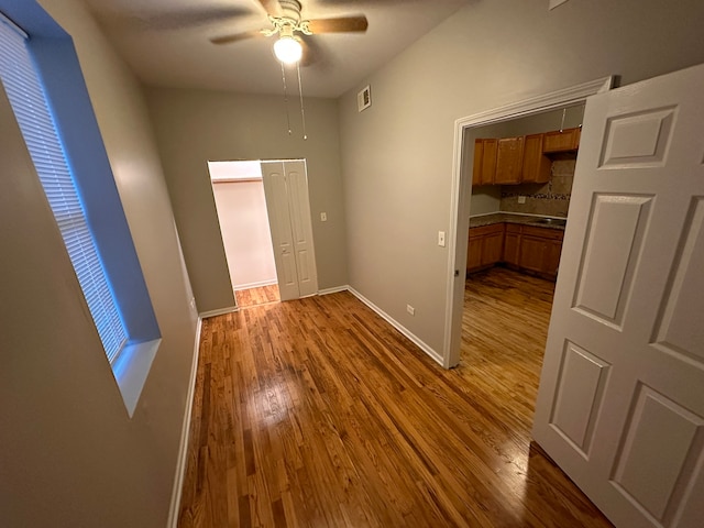 interior space featuring hardwood / wood-style floors and ceiling fan