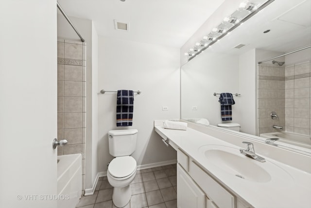 full bathroom with tile patterned flooring, vanity, toilet, and tiled shower / bath