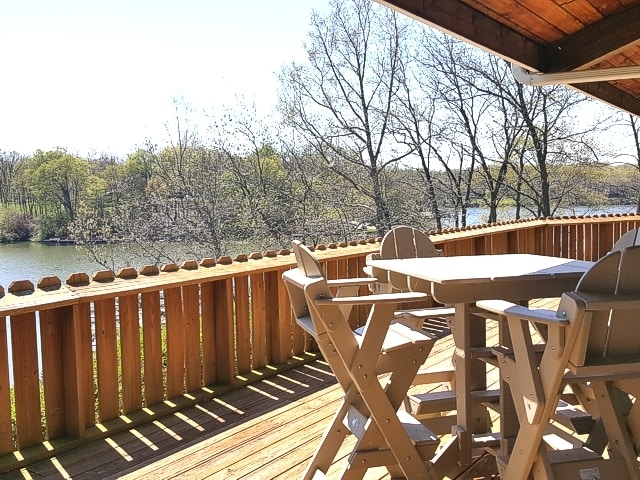 wooden deck featuring a water view