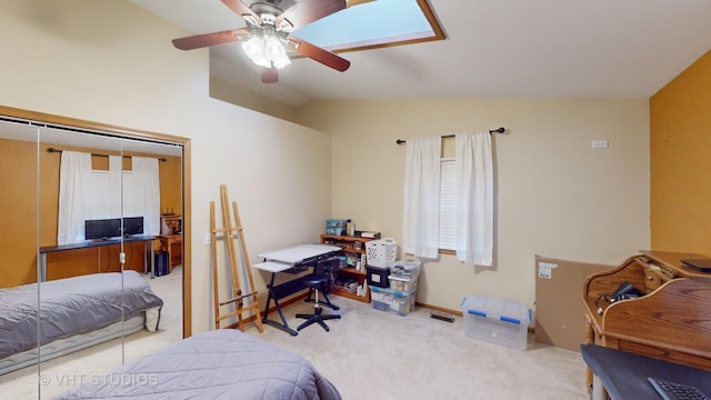 carpeted bedroom featuring ceiling fan and vaulted ceiling