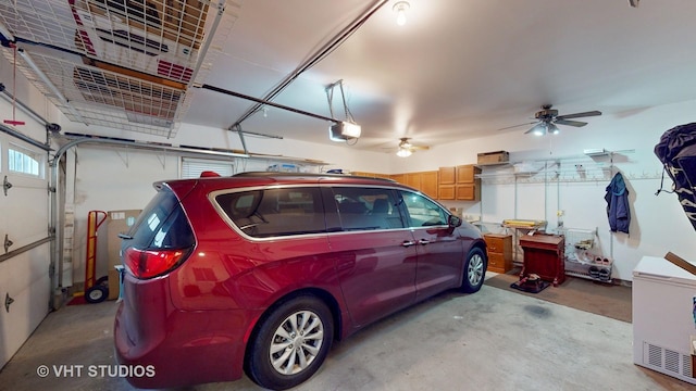 garage featuring a garage door opener and ceiling fan