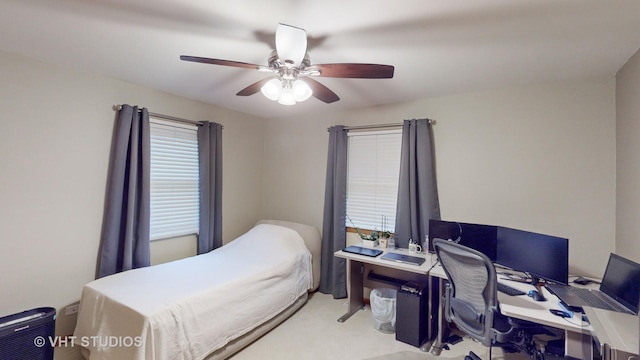 bedroom featuring ceiling fan and light colored carpet