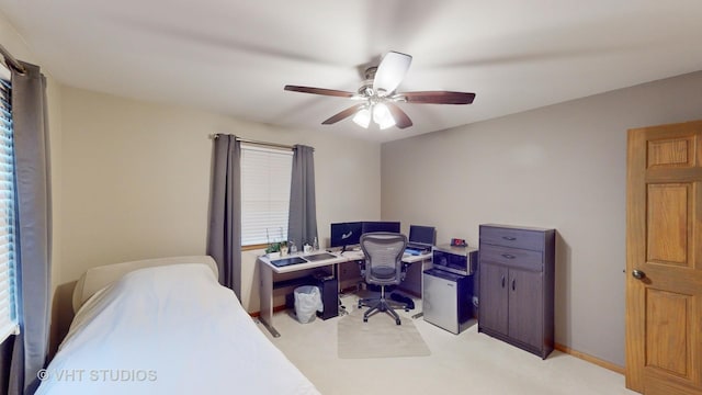 bedroom featuring ceiling fan and light carpet