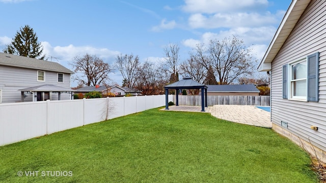 view of yard with a gazebo and a patio area