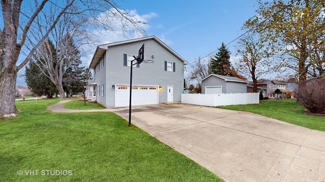 view of side of property with a yard and a garage