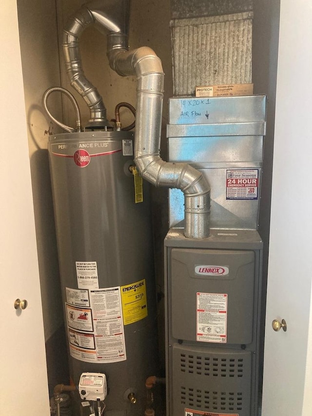 utility room with gas water heater