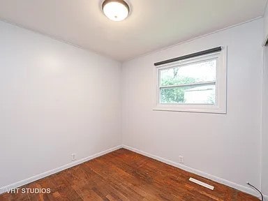 empty room featuring dark hardwood / wood-style floors