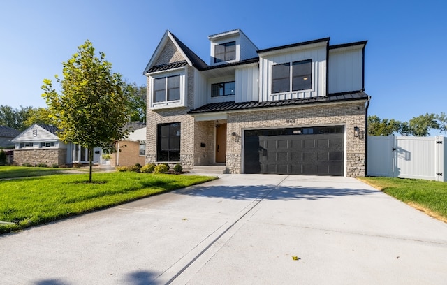 view of front of house featuring a front yard and a garage