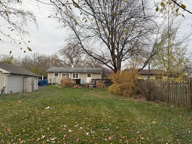 view of yard featuring an outbuilding and a deck