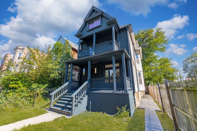 view of front of house featuring a porch and a balcony