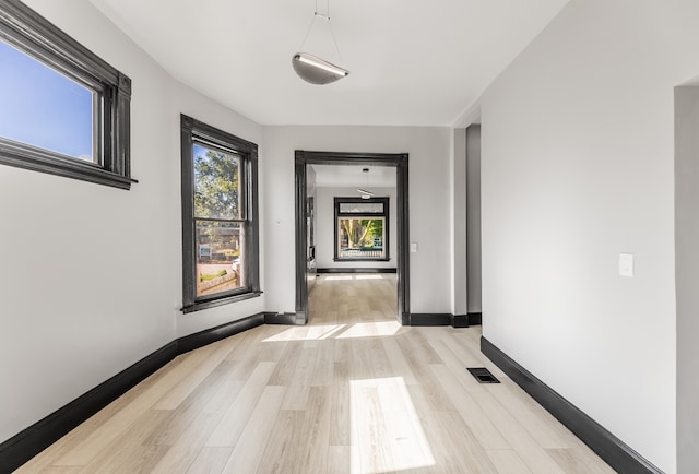 hallway featuring light wood-type flooring