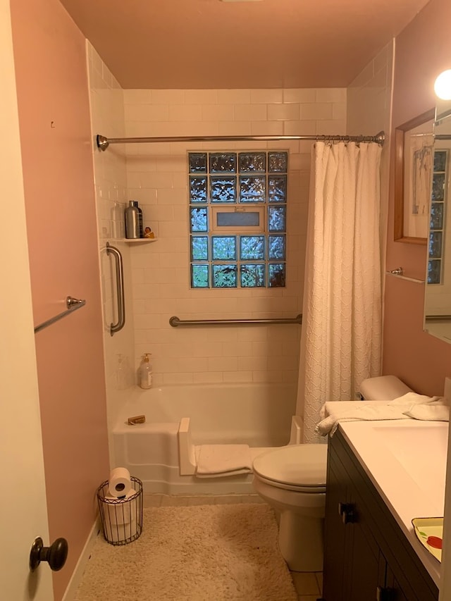 full bathroom with vanity, toilet, and shower / tub combo with curtain