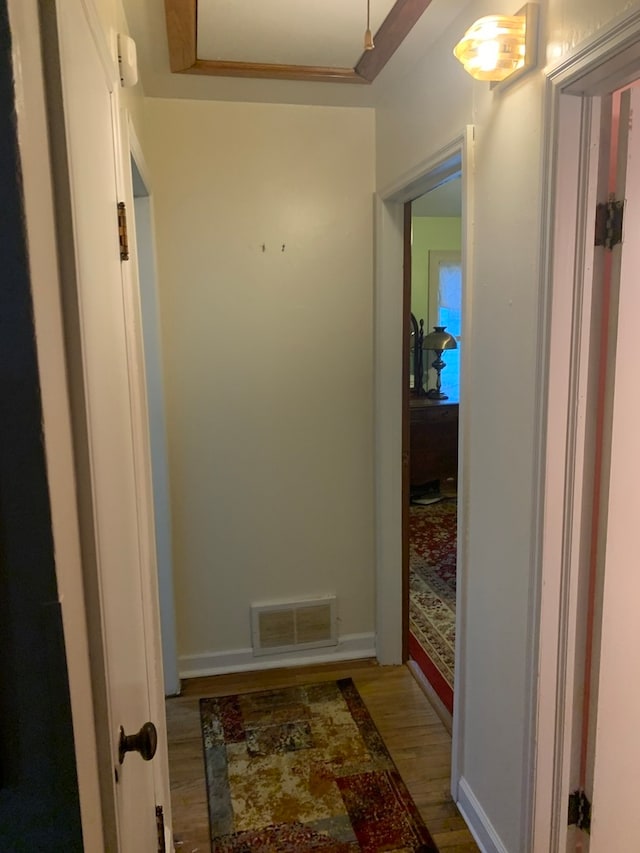 hallway featuring hardwood / wood-style flooring