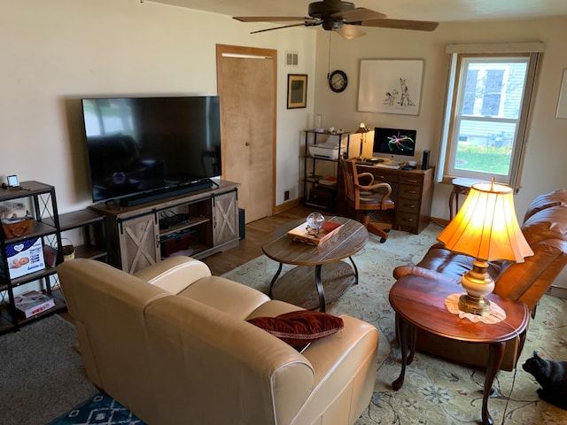 living room with ceiling fan and light hardwood / wood-style floors