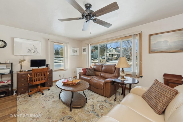 living room with ceiling fan and hardwood / wood-style floors