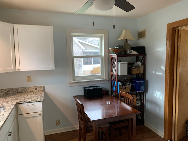 dining space featuring dark hardwood / wood-style floors and ceiling fan