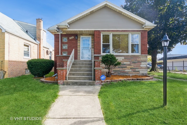 bungalow-style home with a front yard