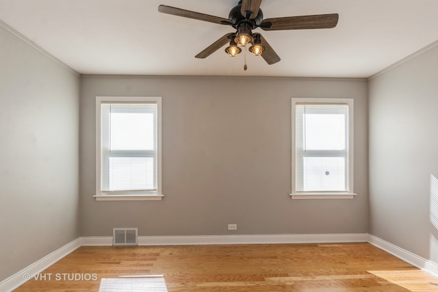 unfurnished room with ceiling fan, a healthy amount of sunlight, and light hardwood / wood-style floors