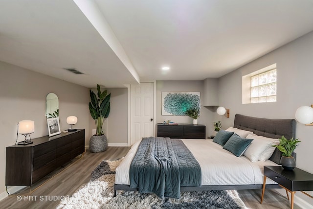 bedroom with light wood-type flooring