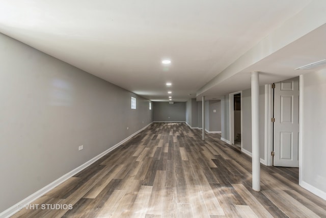 basement featuring dark hardwood / wood-style floors