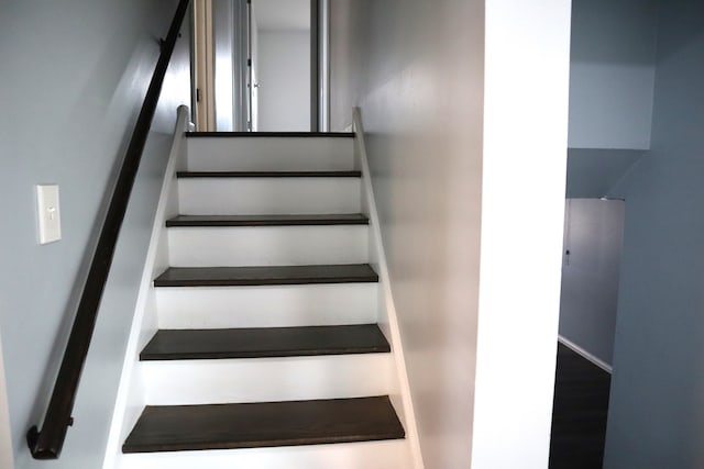 stairway with wood-type flooring