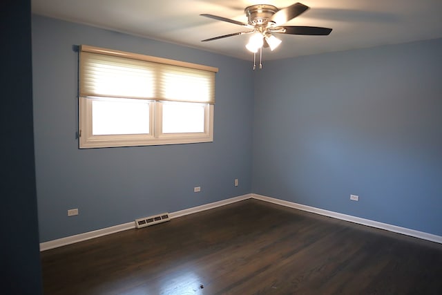 unfurnished room with dark hardwood / wood-style floors and ceiling fan