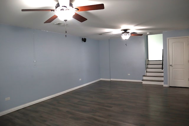 spare room with dark hardwood / wood-style floors and ceiling fan